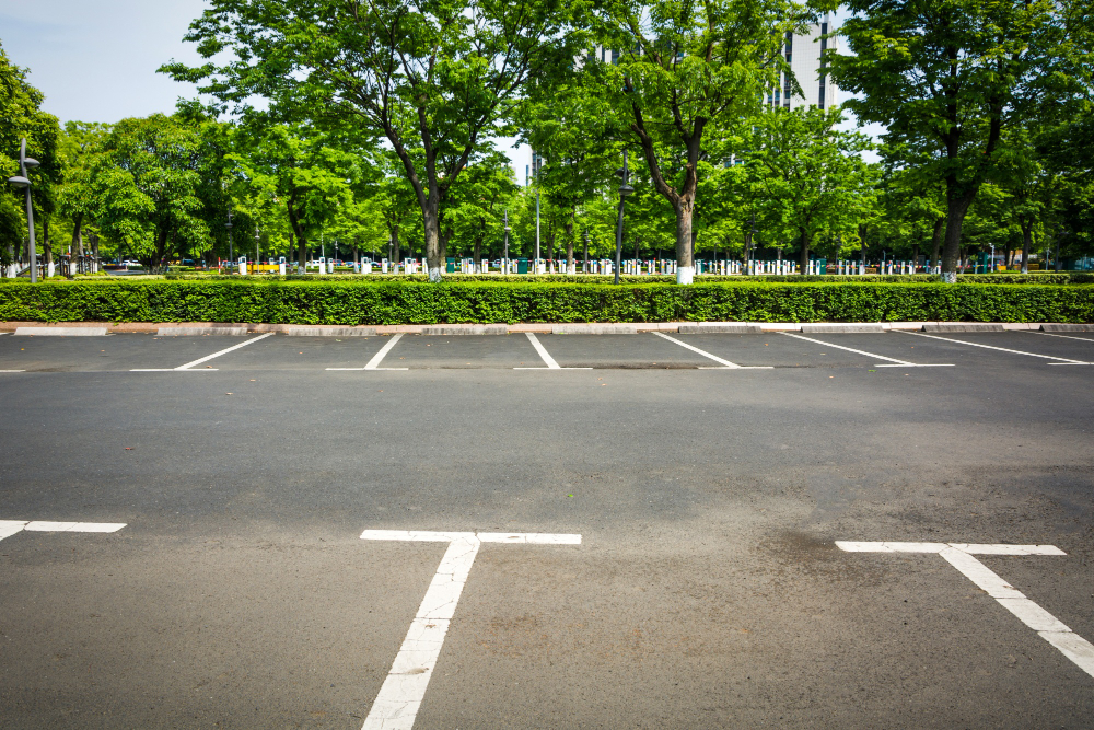 Secure on-site parking framed by greenery